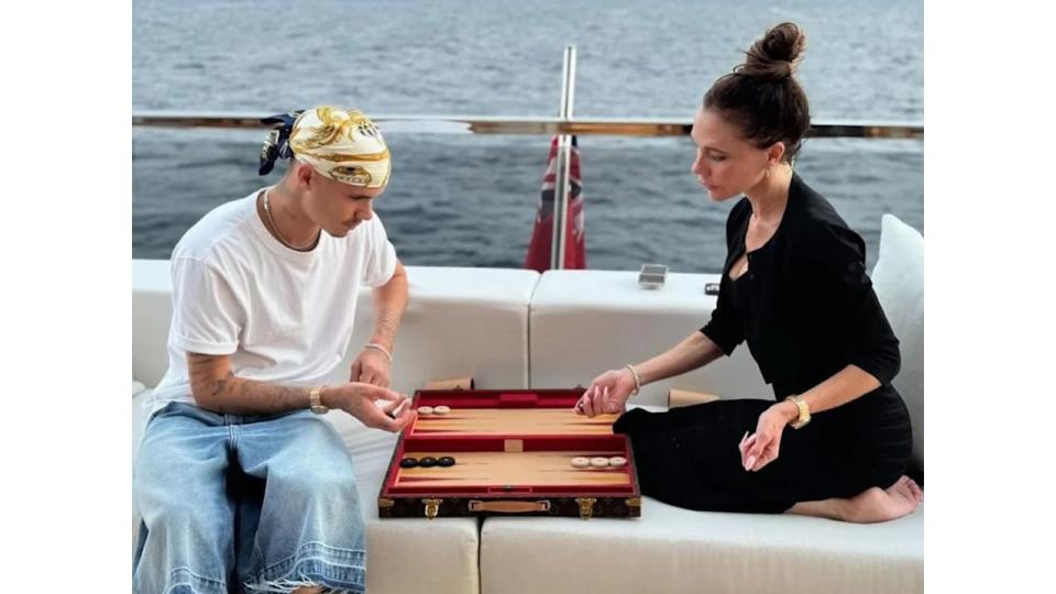 Romeo Beckham and mum Victoria Beckham playing backgammon