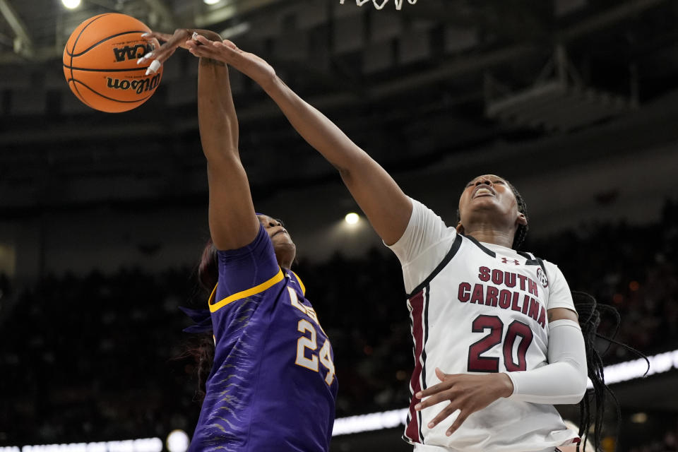 South Carolina forward Sania Feagin is founded by LSU guard Aneesah Morrow during the second half of an NCAA college basketball game at the Southeastern Conference women's tournament final Sunday, March 10, 2024, in Greenville, S.C. (AP Photo/Chris Carlson)