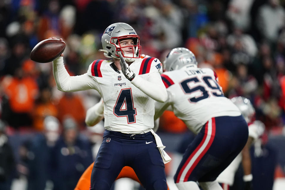 New England Patriots quarterback Bailey Zappe (4) throws during the second half of an NFL football game against the Denver Broncos, Sunday, Dec. 24, 2023, in Denver. (AP Photo/Geneva Heffernan)