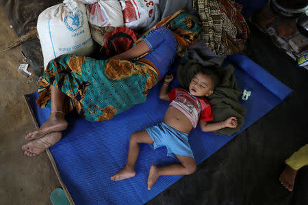 A Rohingya Hindu refugee child sleeps inside the Kutupalong Hindu refugee camp near Cox's Bazar, Bangladesh December 17, 2017. REUTERS/Marko Djurica