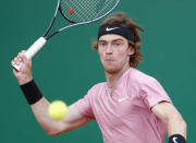 Andrey Rublev of Russia returns the ball to Stefanos Tsitsipas of Greece during the Monte Carlo Tennis Masters tournament finals in Monaco, Sunday, April 18, 2021. (AP Photo/Jean-Francois Badias)