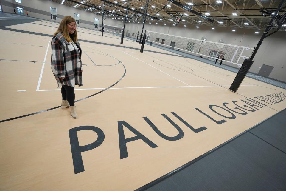 Kathy Loggan walks through a nearly completed Paul Loggan Fieldhouse, which is named after her late husband, Thursday, Jan. 25, 2024, at North Central High School in Indianapolis. Paul, who was North Central's athletic director at the time, died due to complications of COVID-19 in 2020. Kathy said the field house was Paul's dream and the project renderings were still laying on his desk after he passed.