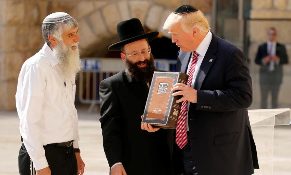 Donald Trump receives a gift at the Western Wall in Jerusalem.