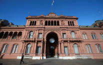 A police officer walks past Argentina's Casa Rosada government house, in Buenos Aires, Argentina March 26, 2019. REUTERS/Agustin Marcarian