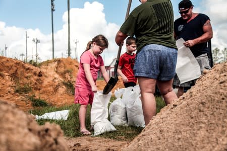 Middleburg locals fill up on sand bags in Clay County with the help of inmates September 1, 2019.