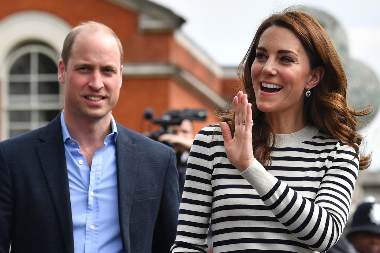 Kate Middleton and her husband Prince William taking a stroll in casual clothing as she waves to the crowd