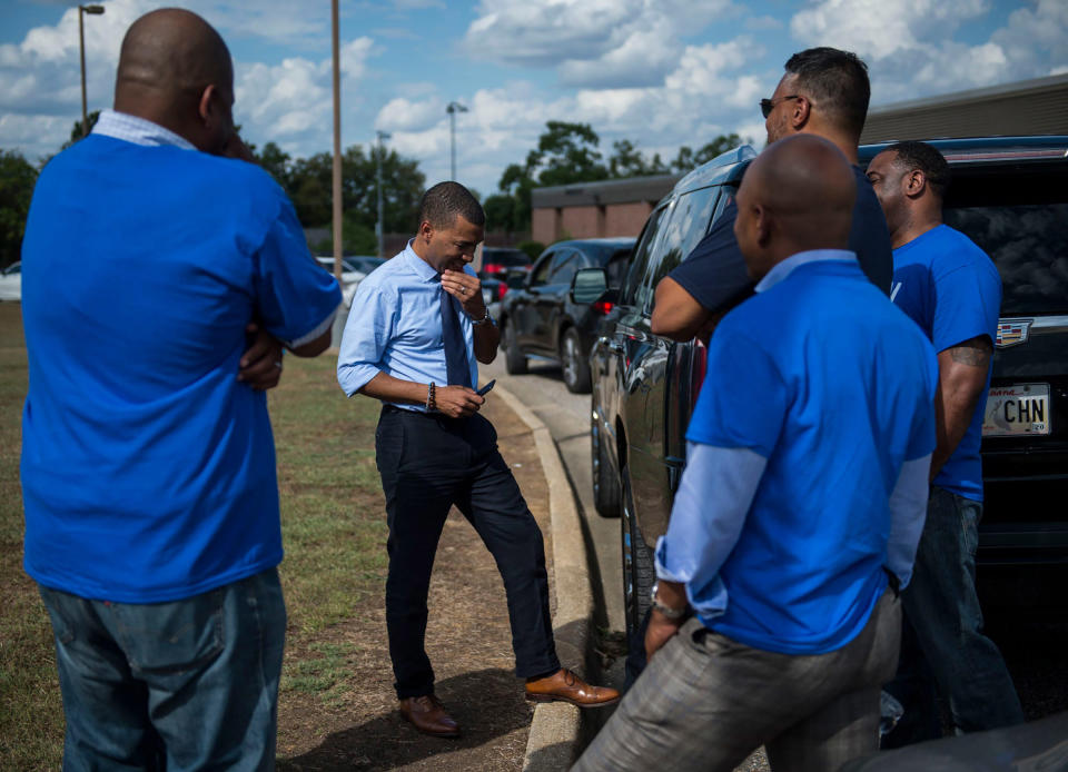 Mayoral candidate Steven Reed talks with his team at Southlawn Elementary School in Montgomery, Ala., on Oct. 8. | Jake Crandall—Montgomery Advertiser/ImagnUSA TODAY/Sipa