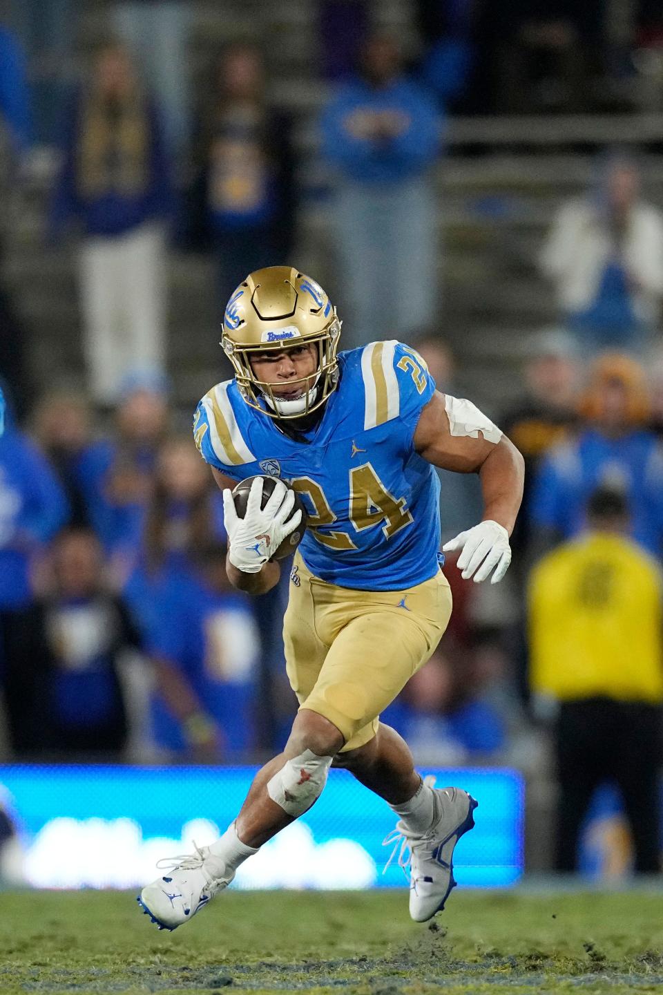 UCLA running back Zach Charbonnet runs the ball during the second half of an NCAA college football game against Arizona on Nov. 12 in Pasadena, California.