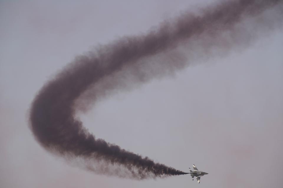 A Chinese L-15 trainer fighter jet performs at the Dubai Air Show in Dubai, United Arab Emirates, Wednesday, Nov. 17, 2021. (AP Photo/Jon Gambrell)