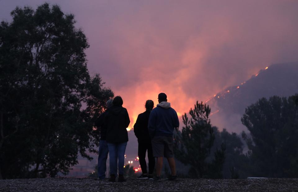 People watch the Blue Ridge fire burn on Foxtail Drive in Yorba Linda.