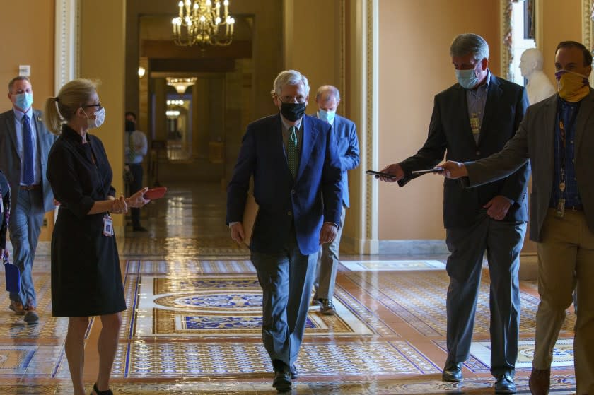 Senate Majority Leader Mitch McConnell of Ky., walks to the Senate floor, Monday, Sept. 14, 2020, on Capitol Hill in Washington. (AP Photo/Jacquelyn Martin)