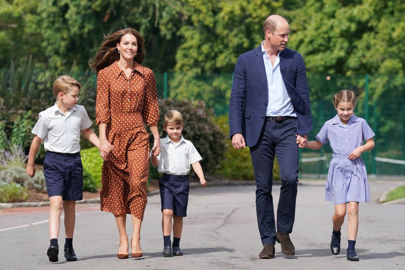 Prince George, Princess Charlotte and Prince Louis (C), accompanied by their parents the Prince William, Duke of Cambridge and Catherine, Duchess of Cambridge, arrive for a settling in afternoon at Lambrook School, near Ascot on September 7, 2022