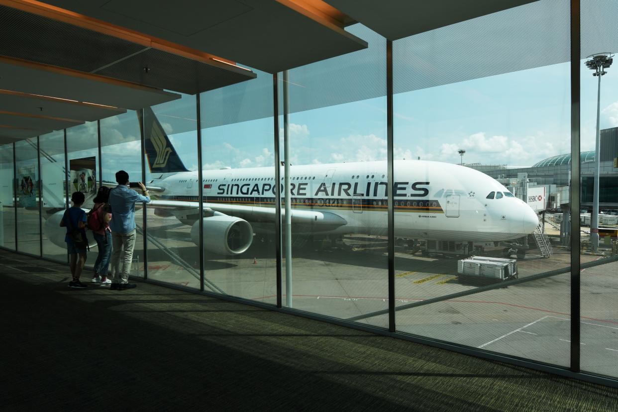 SINGAPORE, Nov. 1, 2020 -- A Singapore Airlines A380 aircraft is seen at Singapore's Changi Airport Terminal 3 on Oct. 31, 2020. Over two weekends from Oct. 24 to Nov. 1, Singapore Airlines hosted diners in two A380 passenger aircraft docked in Changi Airport Terminal 3, offering customers a chance to have meals in an aircraft setting. (Photo by Then Chih Wey/Xinhua via Getty) (Xinhua/Then Chih Wey via Getty Images)