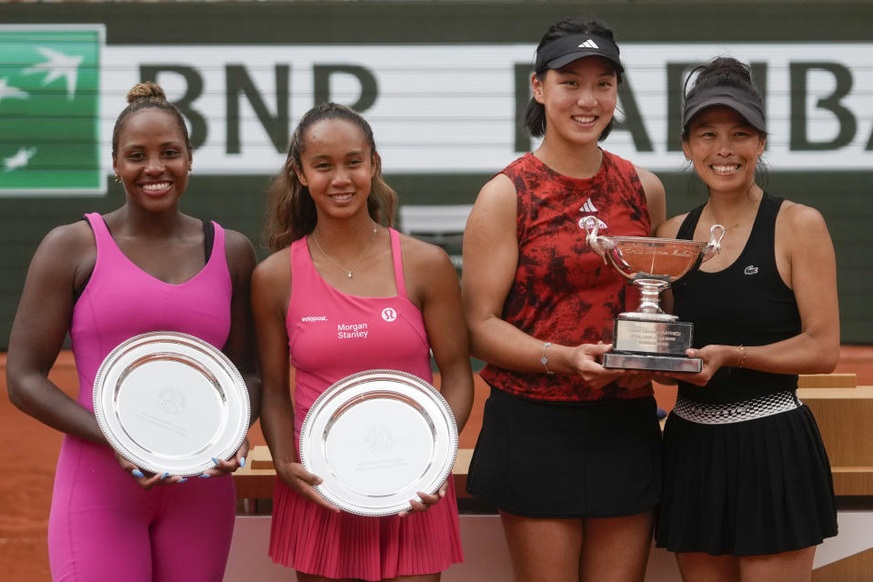 China's Wang Xinyu, second right, and Hsieh Su-Wei of Taiwan, right, pose with their trophy as they celebrate winning the women's doubles final match of the French Open tennis tournament against Canada's Leylah Fernandez, second left, and Taylor Townsend of the U.S., left, at the Roland Garros stadium in Paris, Sunday, June 11, 2023. (AP Photo/Thibault Camus)