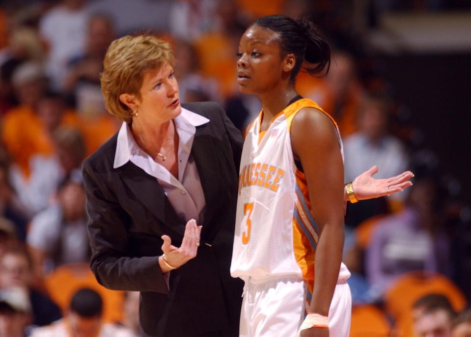 Lady Vols coach Pat Summitt talks to player Tasha Butts during a break in a game against South Carolina.