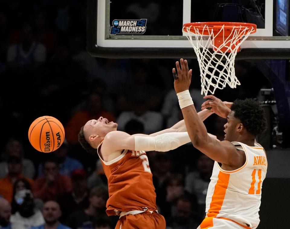 Texas guard Chendall Weaver and Tennessee forward Tobe Awaka battle for the ball during Saturday night's second-round game in the NCAA Tournament. The second-seeded Volunteers won 62-58. Texas will need to replace a handful of key players next season.