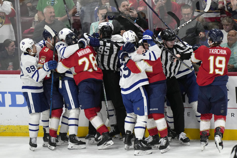 Players fight during the first period of an NHL hockey game between the Florida Panthers and the Toronto Maple Leafs, Tuesday, April 16, 2024, in Sunrise, Fla. (AP Photo/Wilfredo Lee)