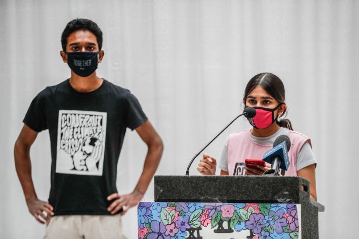 Students in bipartisan group &quot;Confront the Climate Crisis,&quot; Rahul Durai, left, and Siya Goel, right, speak to fellow students and legislators on legislative advocacy day, Jan. 18, 2022, at the Indiana Statehouse.  