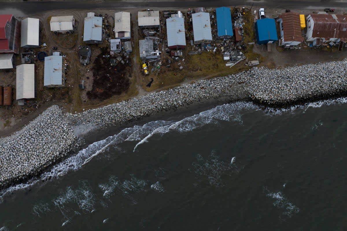 Rising sea levels, flooding, increased erosion and loss of protective sea ice and land are threatening residents of island communities  (AP)