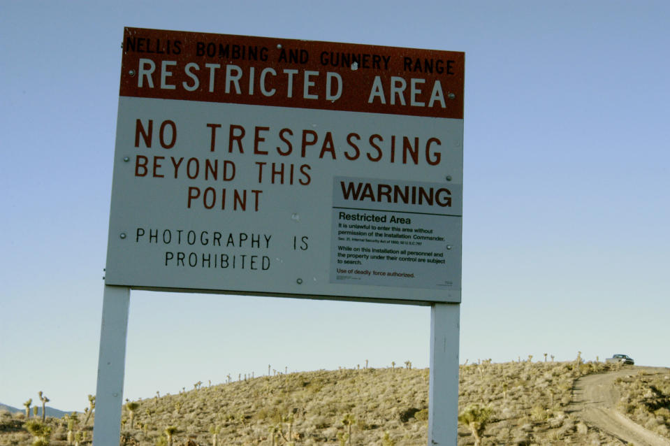 There are extensive signs warning 'No trespassing' around the site.