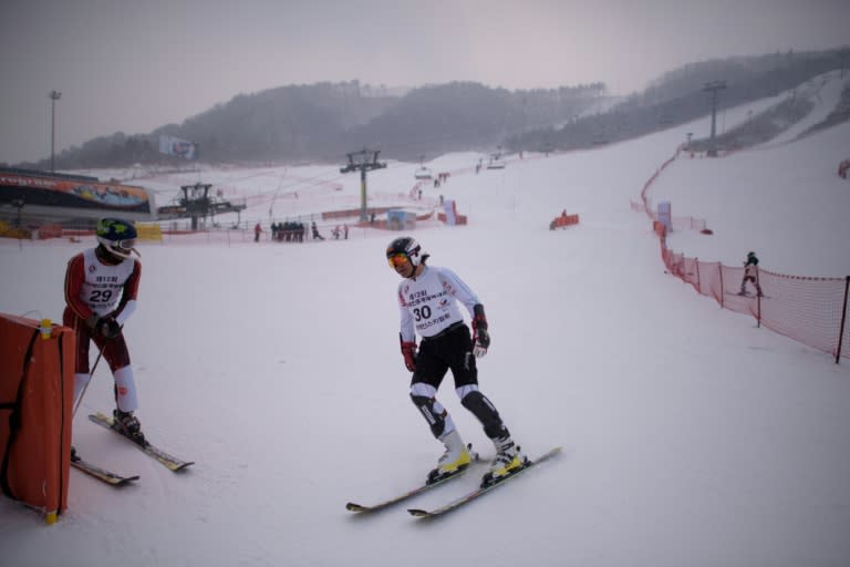 Skiers complete a slalom at the Alpensia resort, a venue of the Pyeongchang 2018 winter Olympics, in Pyeongchang on February 10, 2015