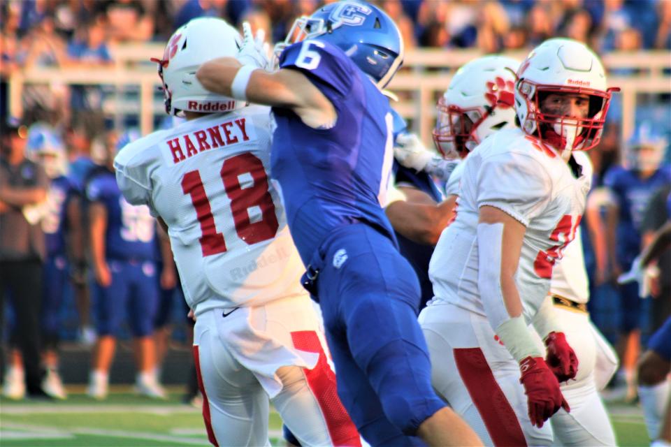 Covington Catholic's Oliver Bent gets pressure on Beechwood QB Cash Harney as Covington Catholic defeated Beechwood 31-14 Sept. 16, 2022.