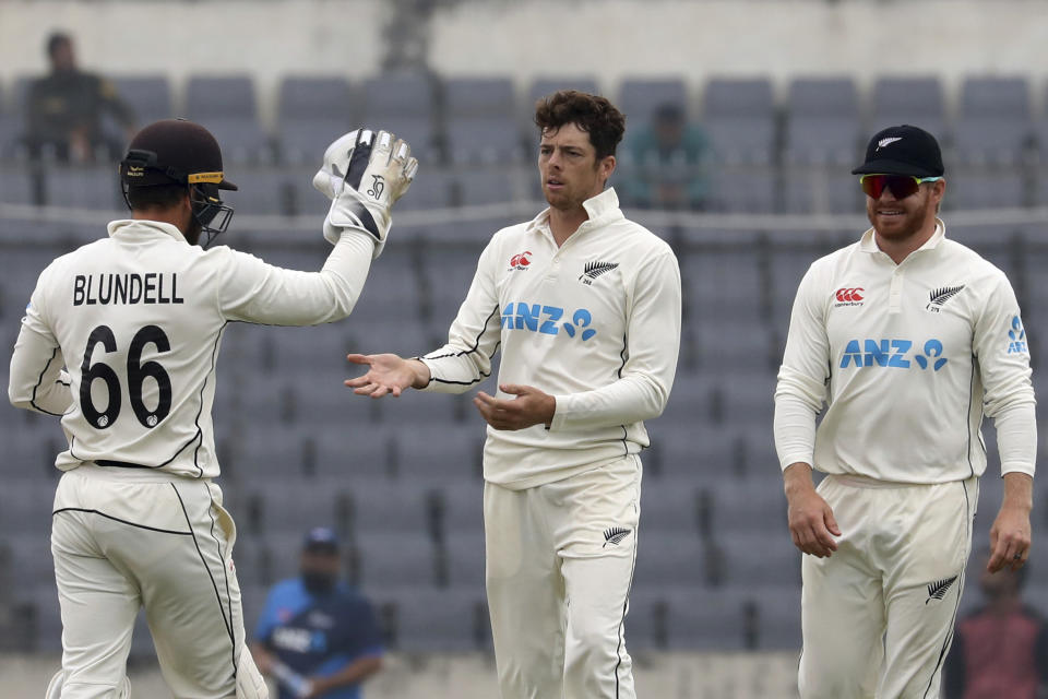 New Zealand Bowler Mitchell Santner celebrates the wicket of Bangladesh's Nayeem Hasan during the fourth day of the second test cricket match between Bangladesh and New Zealand in Dhaka, Bangladesh, Saturday, Dec. 9, 2023. (AP Photo/Mosaraf Hossain)