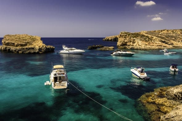 Boats on blue and turquoise water, Malta