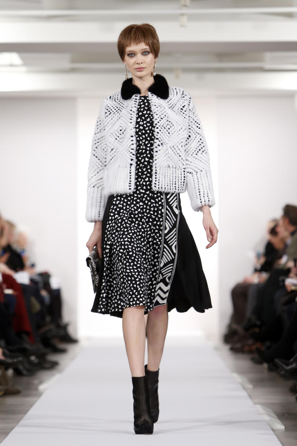 The Oscar de la Renta Fall 2014 collection is modeled during Fashion Week in New York, Tuesday, Feb. 11, 2014. (AP Photo/Jason DeCrow)