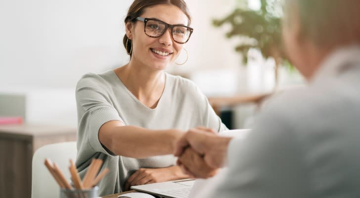 Young woman talking with her financial advisor.