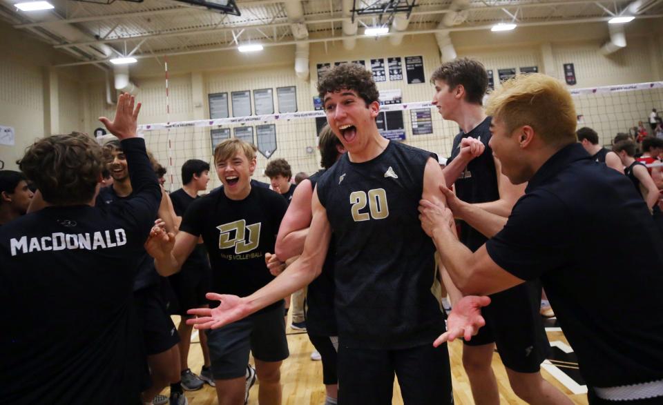 Dublin Jerome's Kai Van Bourgondien and the rest of the Celtics celebrate after defeating Thomas Worthington 25-19, 25-23, 19-25, 13-25, 19-17 in a Division I East Region final May 28 at Westerville Central.