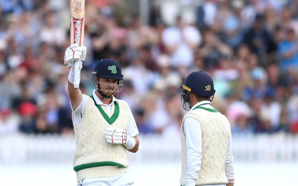 Mark Adair raises his bat after passing fifty for Ireland - Gareth Copley/Getty Images Europe