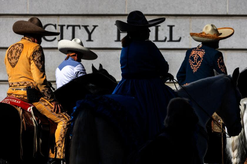 LOS ANGELES, CA - DECEMBER 05: Supporters of rodeo on their horses rally outside city hall as L.A. City Council debates banning rodeo in city limits on Tuesday, Dec. 5, 2023 in Los Angeles, CA. (Irfan Khan / Los Angeles Times)