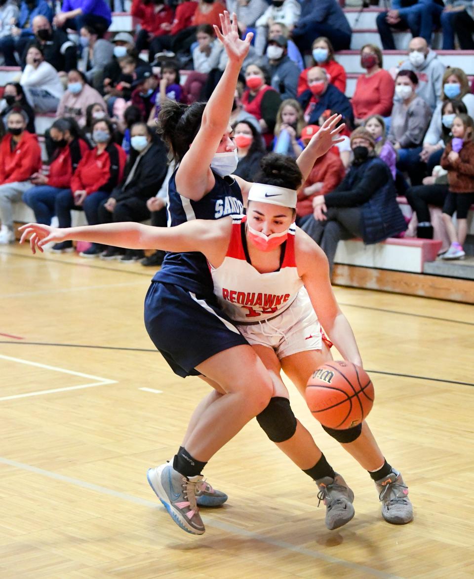 Olivia Gourdine of Barnstable moves past Grace Cohen of Sandwich during a Feb. 18, 2022 game in Hyannis.