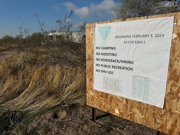 A sign informs people residing on federal land near Apache Junction in Pinal County of an impending closure starting Feb. 5, 2024.