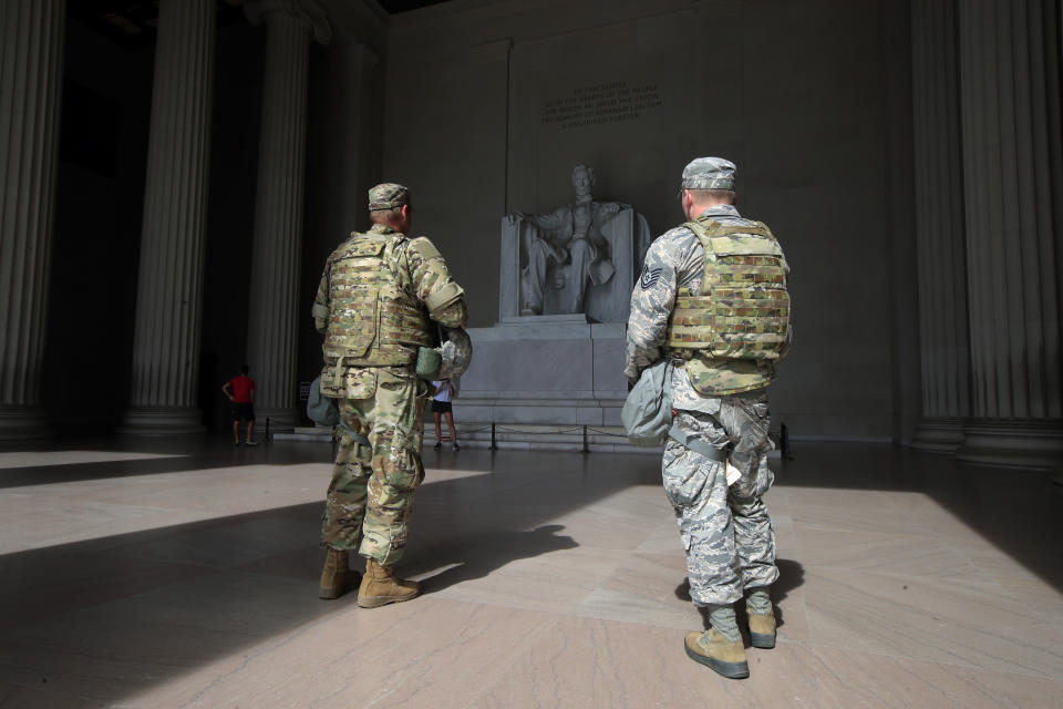 Members of the District of Columbia Army National Guard stand guard at the Lincoln Memorial in Washington, Wednesday, June 3, 2020, securing the area as protests continue following the death of George Floyd, a who died after being restrained by Minneapolis police officers. (AP Photo/Manuel Balce Ceneta)