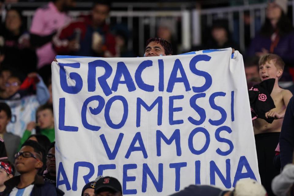 Apr 27, 2024; Foxborough, Massachusetts, USA; Inter Miami CF fans hold up signs in the second half against the New England Revolution at Gillette Stadium. Mandatory Credit: Paul Rutherford-USA TODAY Sports