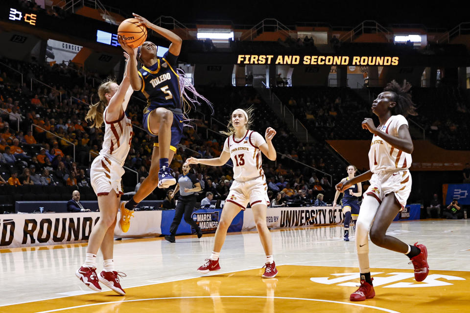 Toledo guard Quinesha Lockett (5) shoots past Iowa State guard Ashley Joens, left, in the first half of a first-round college basketball game in the NCAA Tournament, Saturday, March 18, 2023, in Knoxville, Tenn. (AP Photo/Wade Payne)