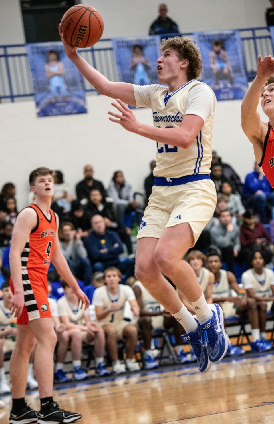 Detroit Catholic Central's TJ Nadeau scores in traffic during a Catholic League-Central boys basketball game on Thursday, Jan. 4, 2024.