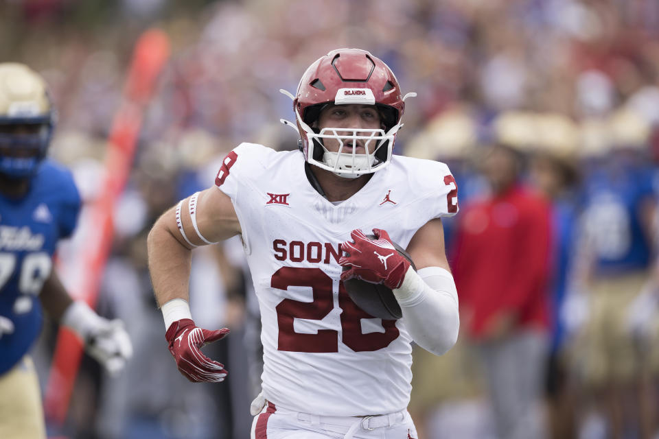 FILE - Oklahoma linebacker Danny Stutsman (28) runs for a touchdown following an interception during the first half of an NCAA college football game against Tulsa, Saturday, Sept. 16, 2023, in Tulsa, Okla. Arizona will face traditional power Oklahoma in the Alamo Bowl. (AP Photo/Alonzo Adams, file)