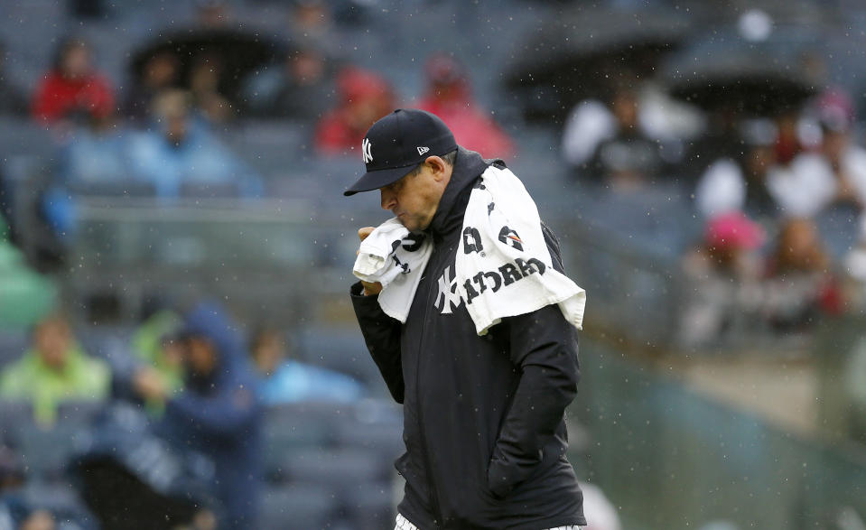 New York Yankees manager Aaron Boone walks back to the dugout during a baseball game against the Arizona Diamondbacks, Sept. 24, 2023, in New York. (AP Photo/John Munson)