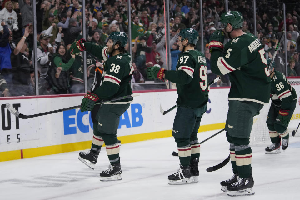 Minnesota Wild right wing Ryan Hartman (38) celebrates after scoring against the Edmonton Oilers during the first period of an NHL hockey game Tuesday, Oct. 24, 2023, in St. Paul, Minn. (AP Photo/Abbie Parr)