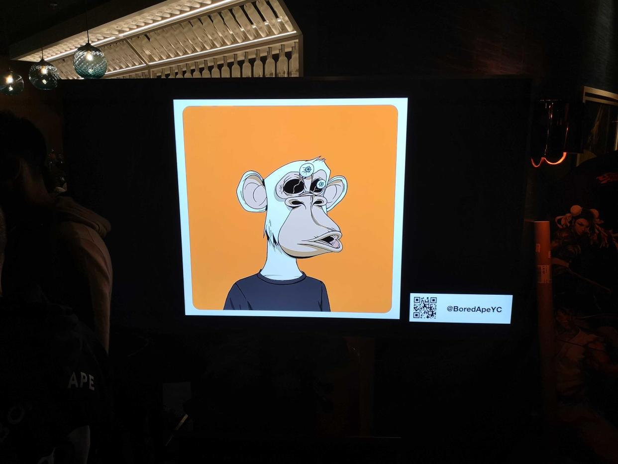 A Bored Ape on a plasma screen at the venue