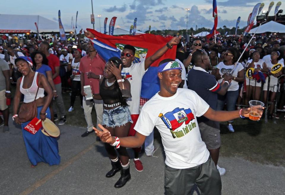 Guerlins Dareus dances to the beat of performers during the Haitian Compas Festival at Sun Life Stadium on Saturday, May 16, 2015. Al Diaz/Miami Herald Staff