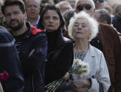 People line up to pay the last respects at the coffin of former Soviet President Mikhail Gorbachev outside the Pillar Hall of the House of the Unions during a farewell ceremony in Moscow, Russia, Saturday, Sept. 3, 2022. Gorbachev, who died Tuesday at the age of 91, will be buried at Moscow's Novodevichy cemetery next to his wife, Raisa, following a farewell ceremony at the Pillar Hall of the House of the Unions, an iconic mansion near the Kremlin that has served as the venue for state funerals since Soviet times. (AP Photo)