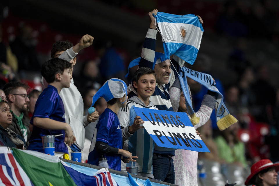 Argentina fans cheer as the team scores a try against New Zealand during gold-medal Vancouver Sevens rugby match action in Vancouver, British Columbia, Sunday, Feb. 25, 2024. (Ethan Cairns/The Canadian Press via AP)