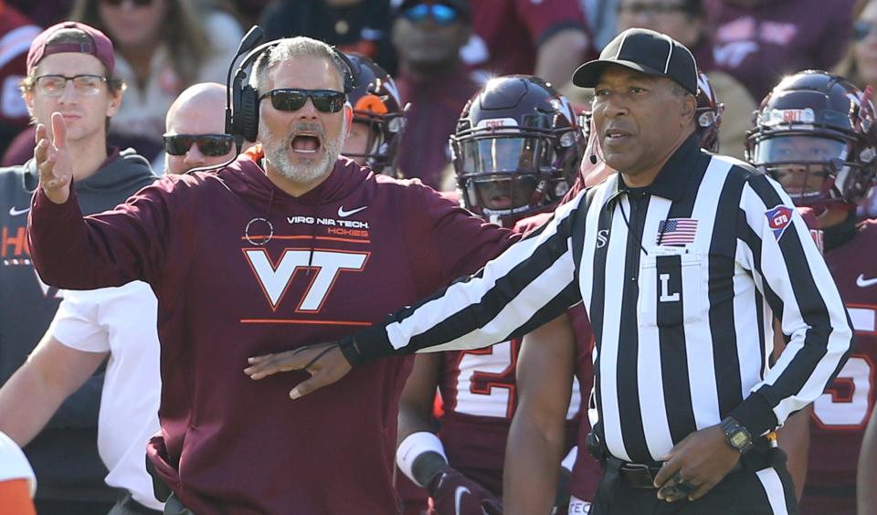 Virginia Tech head coach Justin Fuente disputes call with an official call during the second half against Syracuse.
