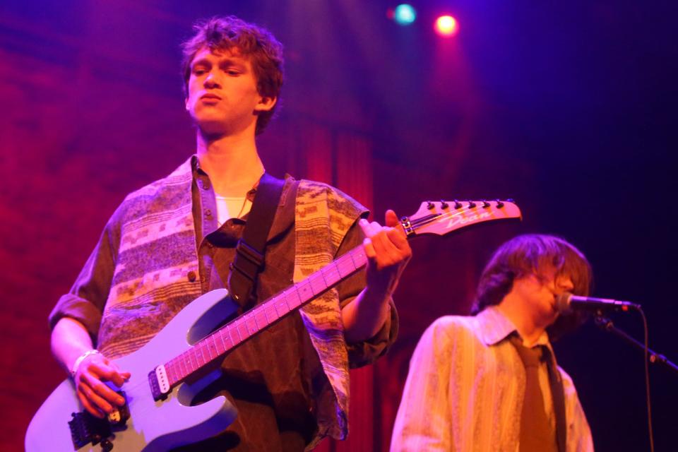 Bovinophobic Bile Puddle’s Everett Bovine, left, plays guitar as Oliver Booth sings Sunday, Feb. 18, 2024 during a local showcase at the Englert Theatre in Iowa City, Iowa.