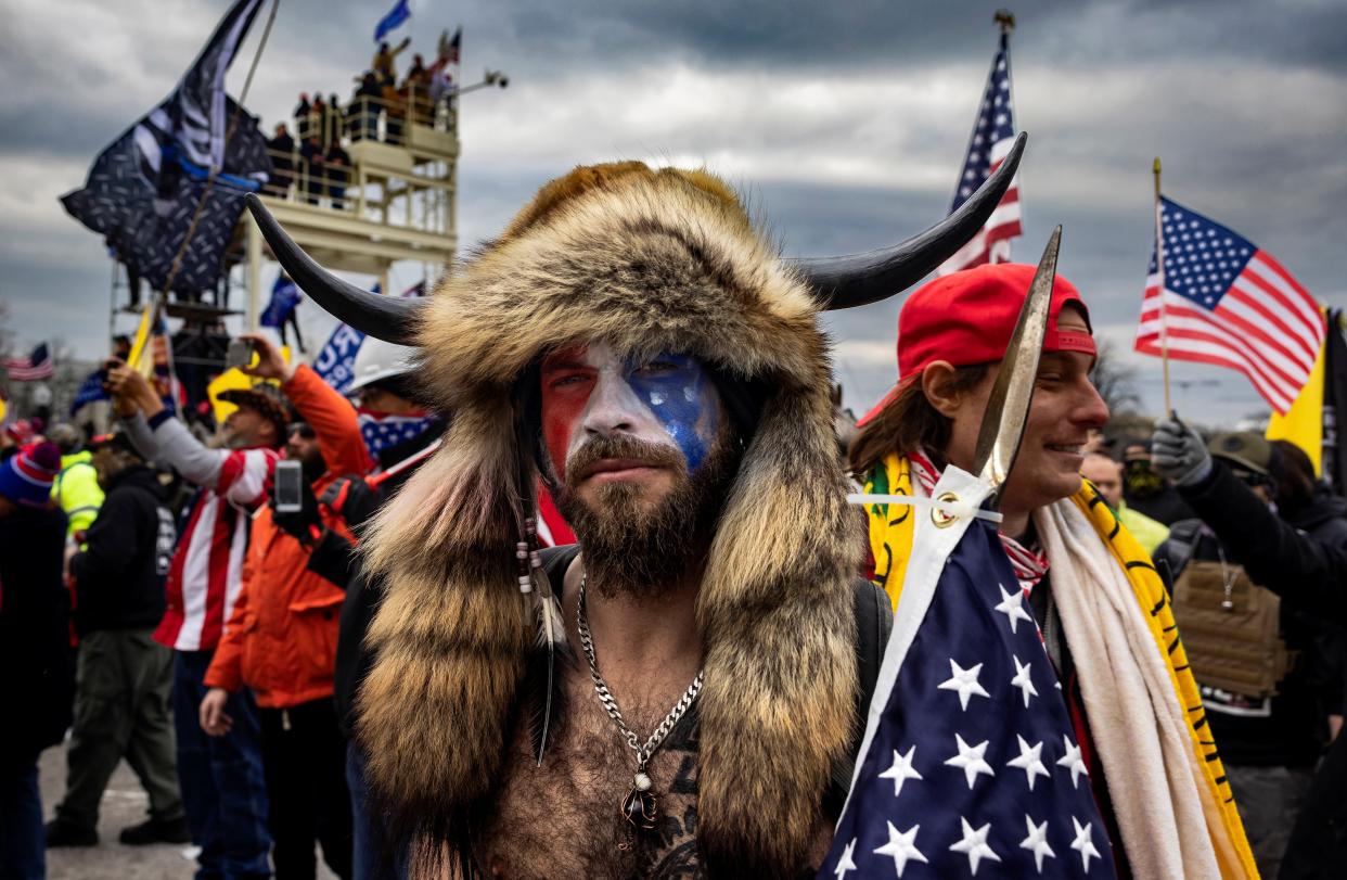 <p>‘QAnon Shaman’ Jacob Chansley infamously wore an animal headdress to the 6 January Capitol riot</p> (Getty Images)