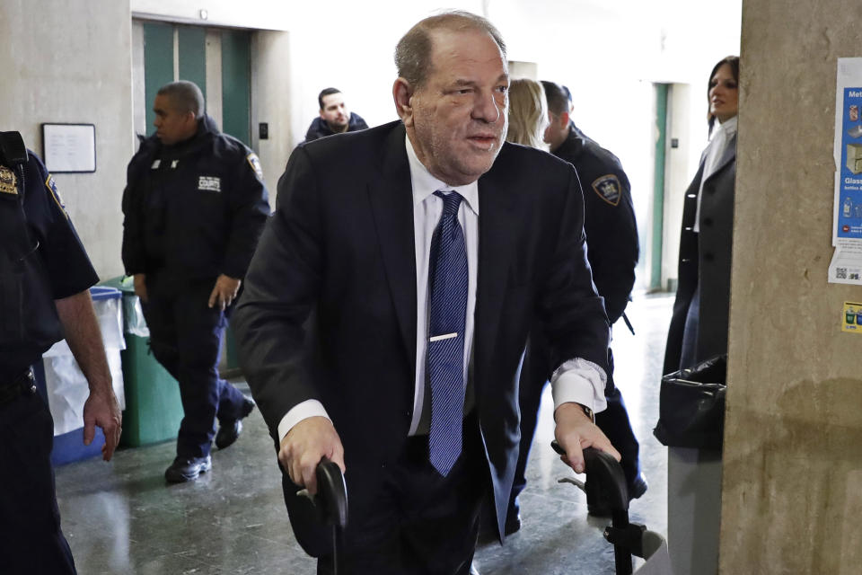 FILE — In this Feb. 21, 2020 file photo, Harvey Weinstein arrives at a Manhattan court as jury deliberations continue in his rape trial, in New York. More than a year after Weinstein's rape conviction, his lawyers are demanding a new trial, arguing in court papers Monday, April 5, 2021, that the landmark #MeToo prosecution that put him behind bars was buoyed by improper rulings from a judge who was "cavalier" in protecting the disgraced movie mogul's right to a fair trial. (AP Photo/Richard Drew, File)